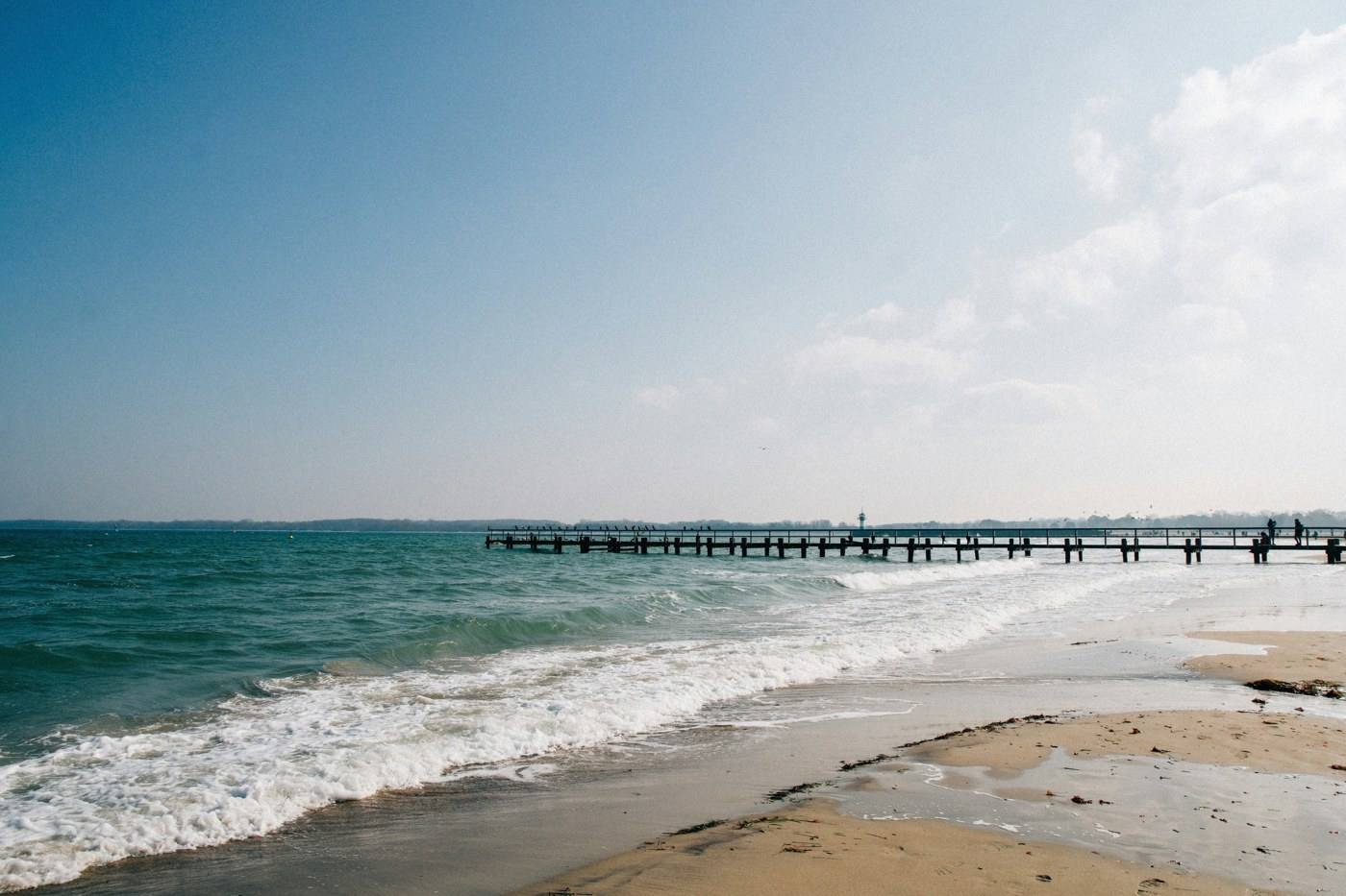 Illustrative photo: Baltic beach with a pier, exact location not identified